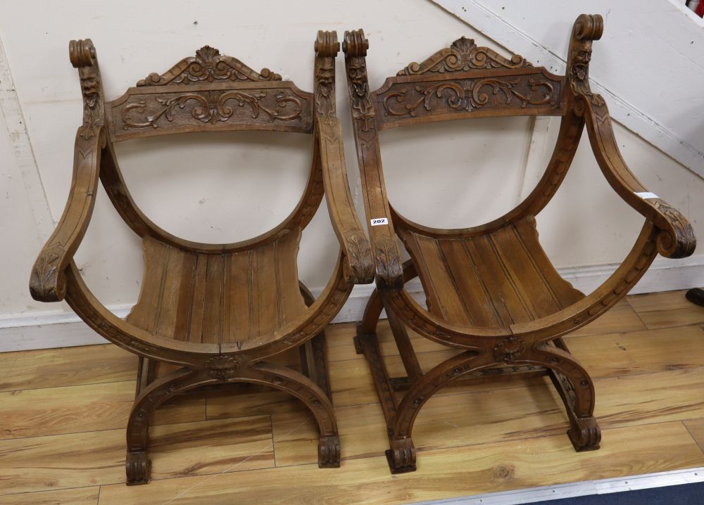 A pair of Italian carved walnut Savonarola type armchairs